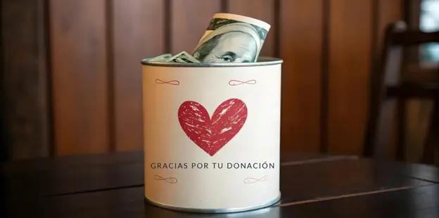 Lata de donaci&oacute;n de FUNARP con el mensaje gracias por tu donaci&oacute;n